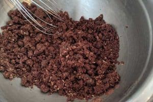 Low sodium choco-coco-rum balls dough in a stainless bowl.