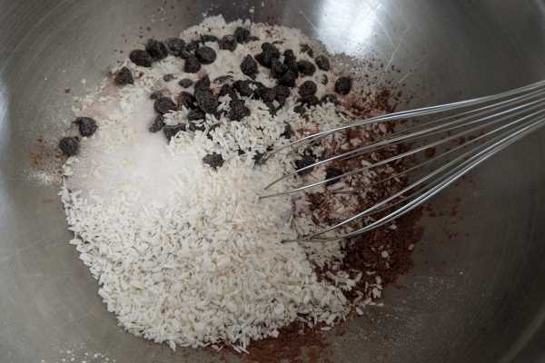 Mixing all the ingredient for making kidney healthy choco-coco-rum balls.