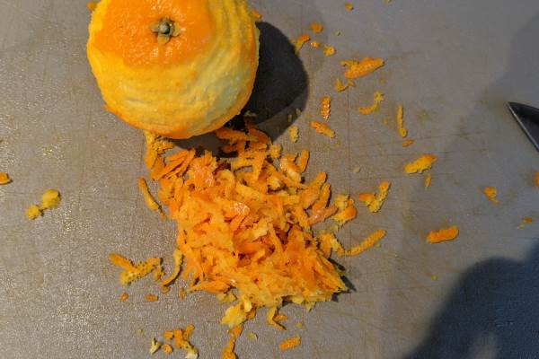 Orange zest on a cutting board.