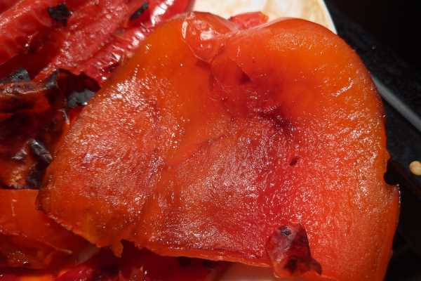 Removing skin of raosted red peppers to make a kidney healthy soup.
