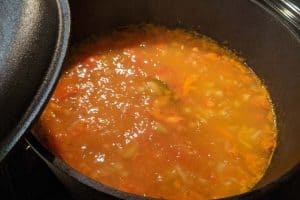 Split-pea soup simmering in a cast iron pot.