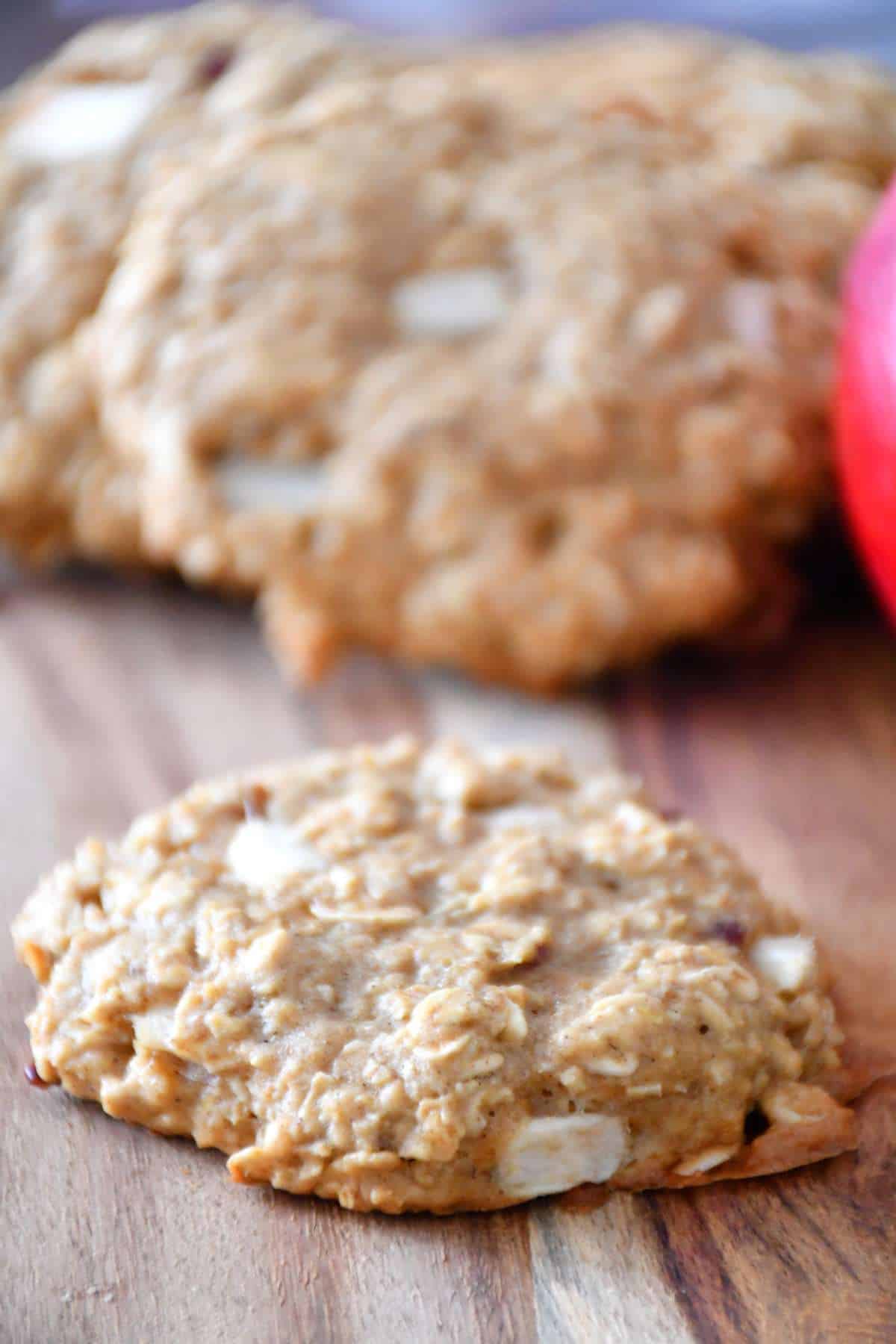 Delicious and chewy apple oatmeal cookies with an apple.