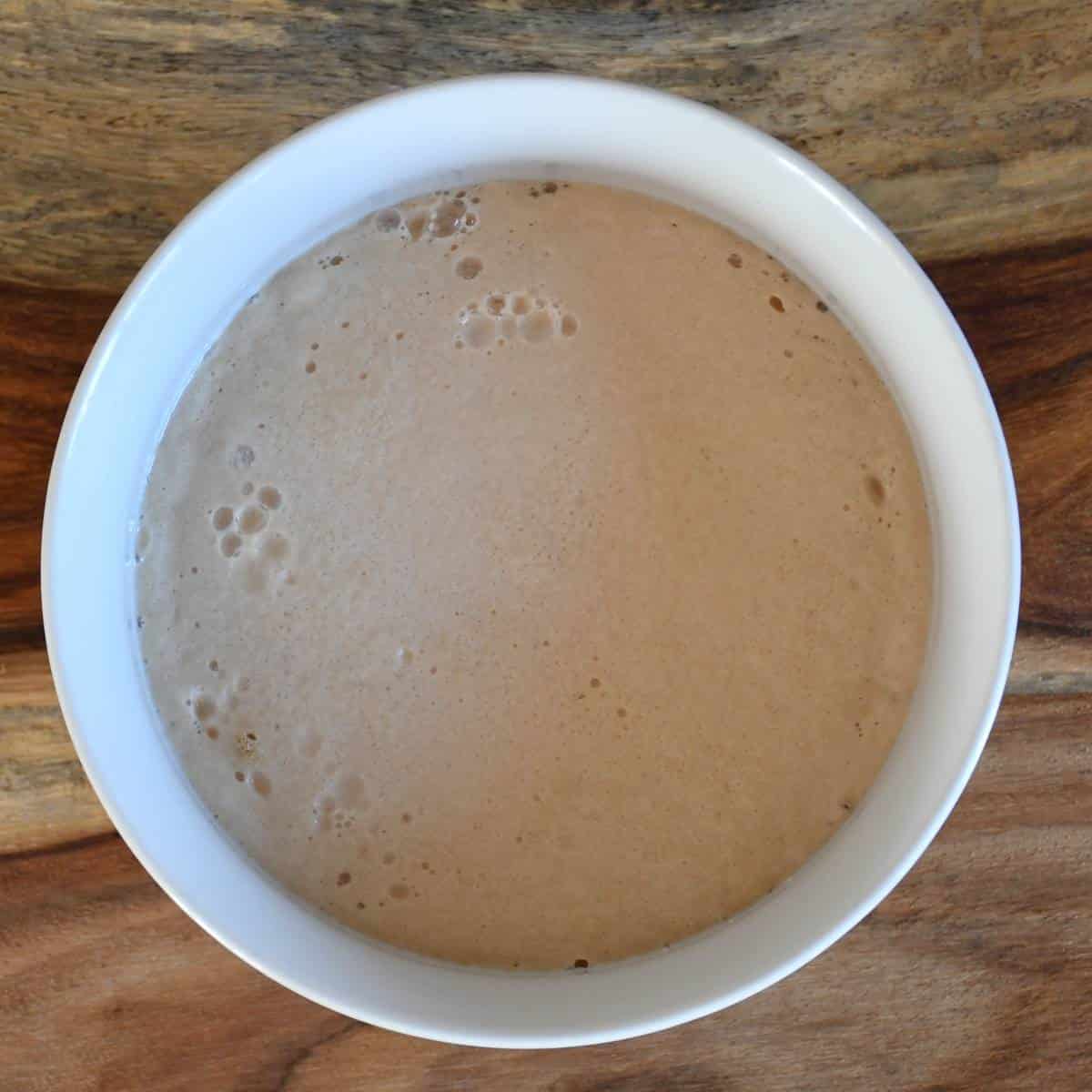 Yeast activation to make unsalted whole wheat pizza dough.