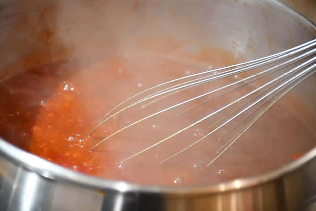 Low sodium BBQ sauce simmering in a saucepan.